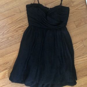 Size 0 black BCBG dress in good condition with layers to add more depth/texture.